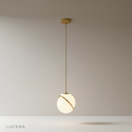 Igneous pendant light studio shot front view with white acrylic sphere and brass iron