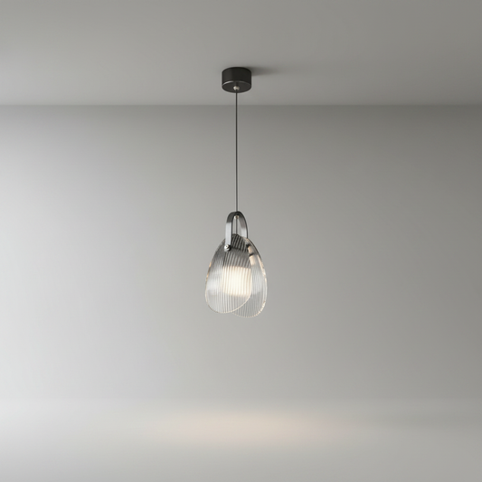 teardrop-shaped fluted glass pendant lamp on clean studio background