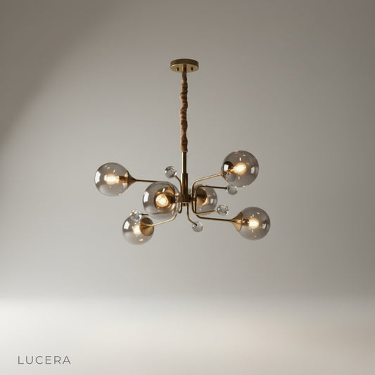 studio shot of Ellipse chandelier with white leaf accents on a clean neutral background