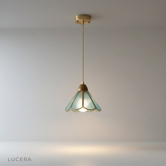 handcrafted copper and glass pendant light on a clean white studio background