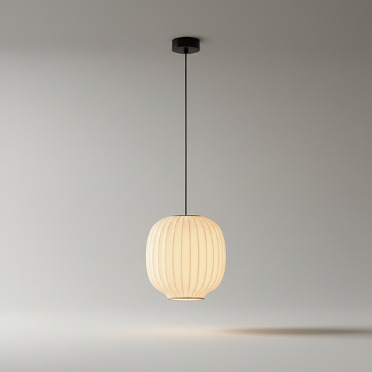 Studio shot of Quoin Pendant Light with luxurious silk shade on clean background