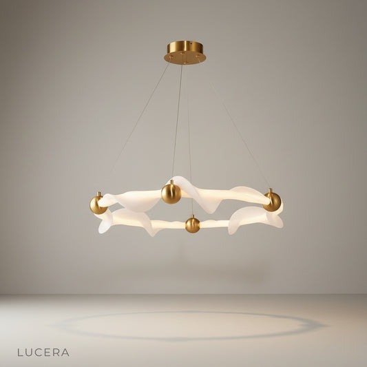 studio shot of Jacinda chandelier with wave-like metal and fabric rings on clean white background