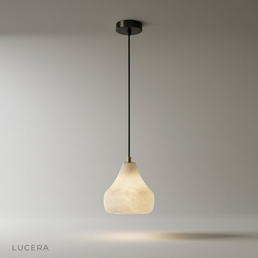 studio shot of ivory alabaster pendant light on clean white background