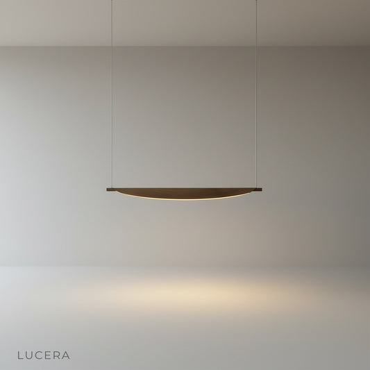 Studio shot of Dia pendant light with curvy silhouette against clean white background