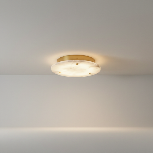 Studio shot of Lucera Transom ceiling light with circular metal frame and marble center