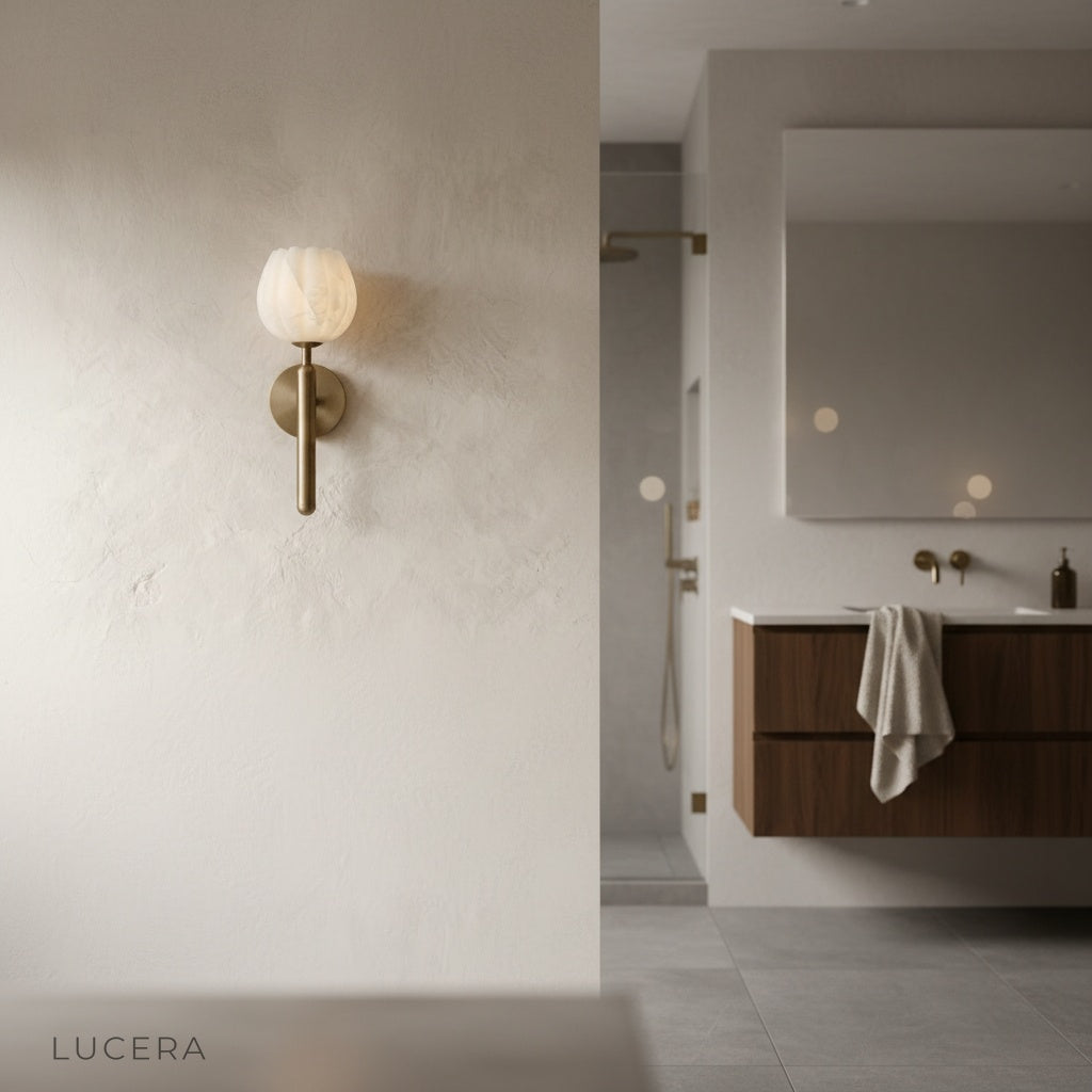 evening lifestyle shot of the Lucera alabaster lamp in a minimalist living room corner