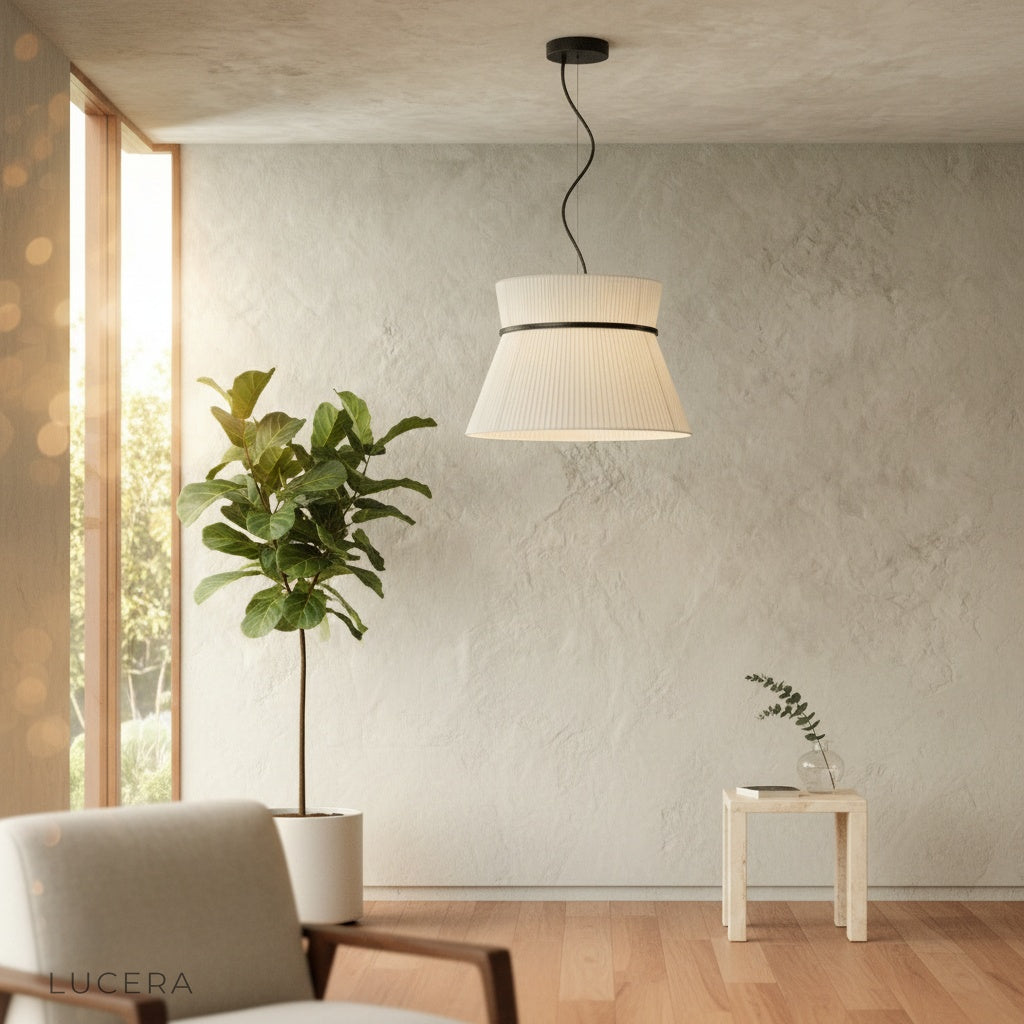 Ilaria pendant light suspended over a rustic kitchen island with natural wood accents and soft shadows