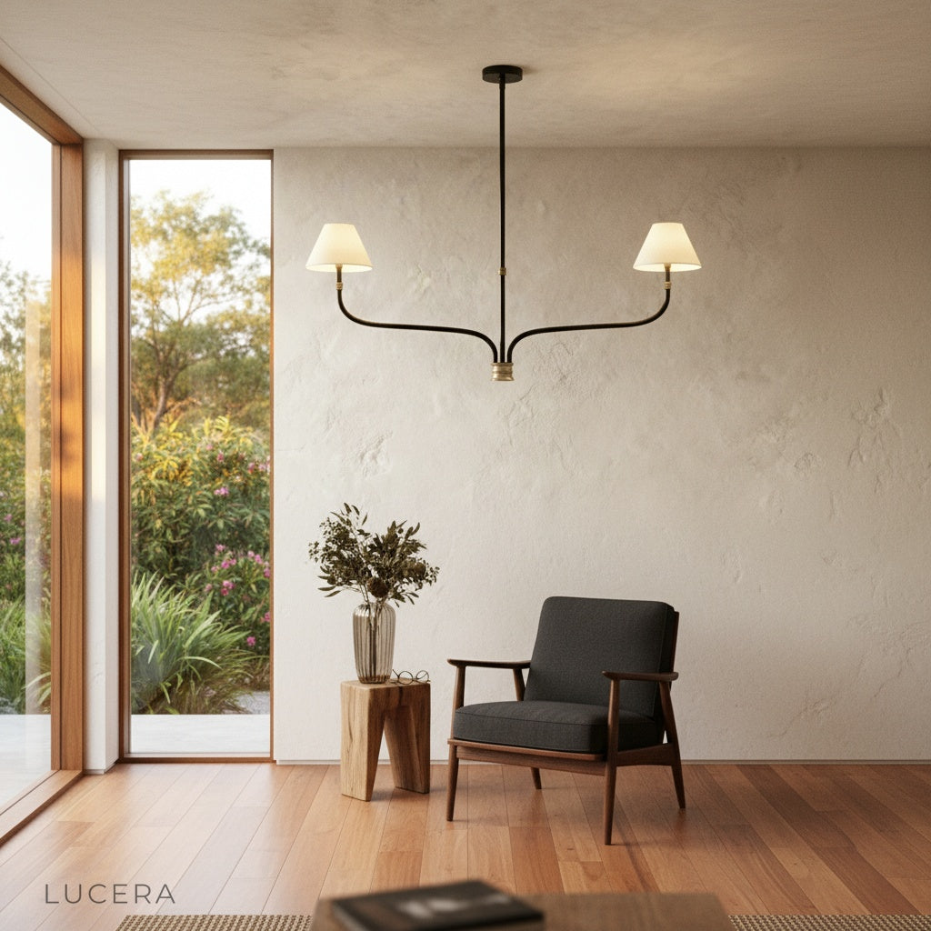 Dusk Chandelier in a transitional bedroom setting with soft evening lighting and linen textures