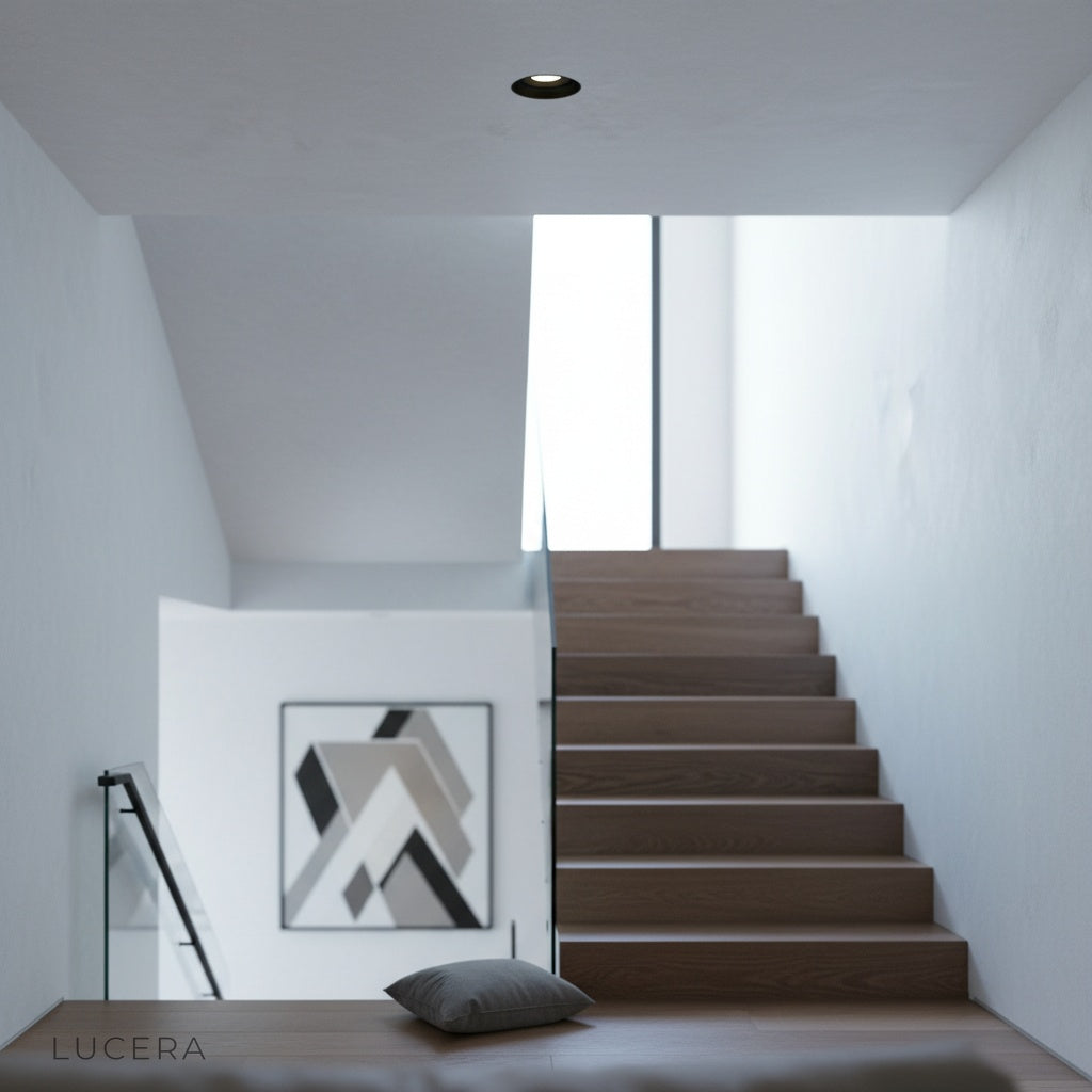 ambient bedroom lighting with xenolith trimless downlight casting soft glow on wall