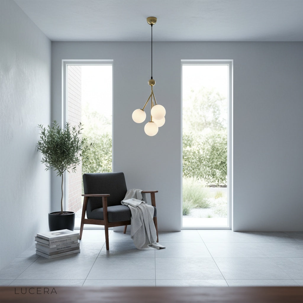 Xaverian pendant light illuminating a minimalist kitchen island with soft ambient light