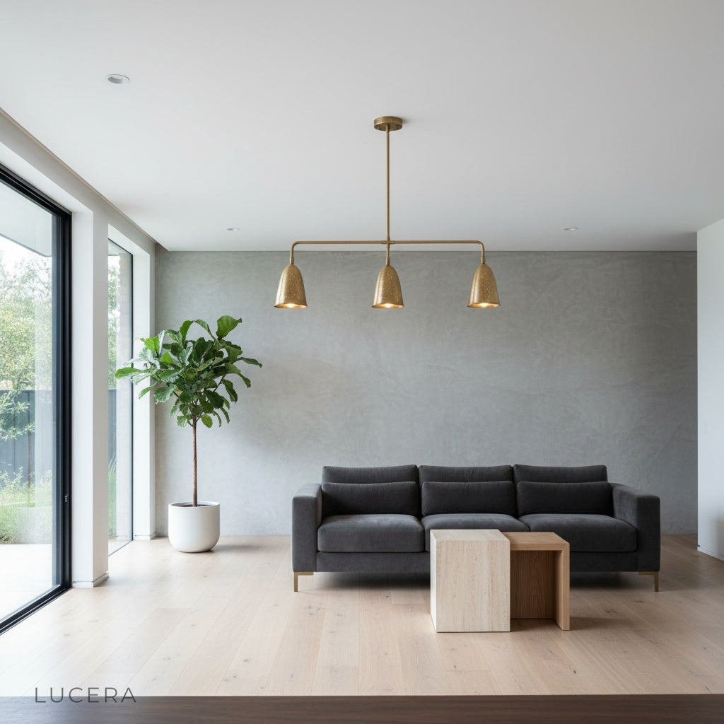 evening lifestyle shot of brass linear chandelier casting soft light in elegant hallway