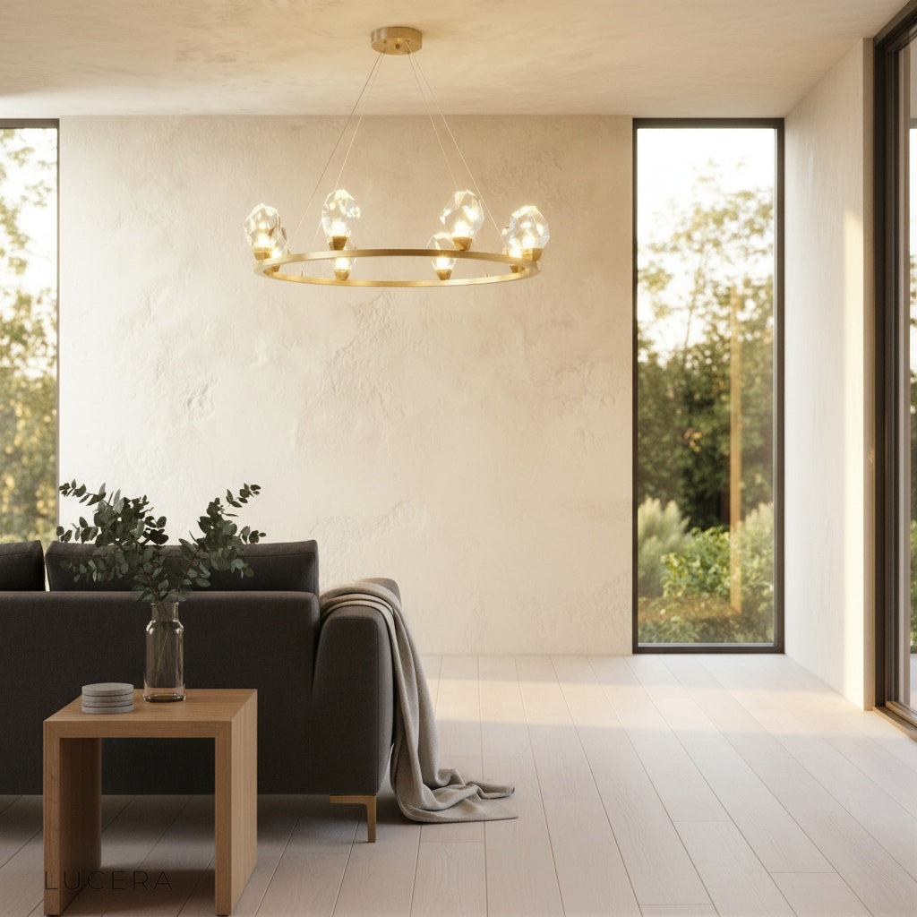 Nighttime lifestyle shot of Mesa Round Chandelier glowing above a chic lounge seating area