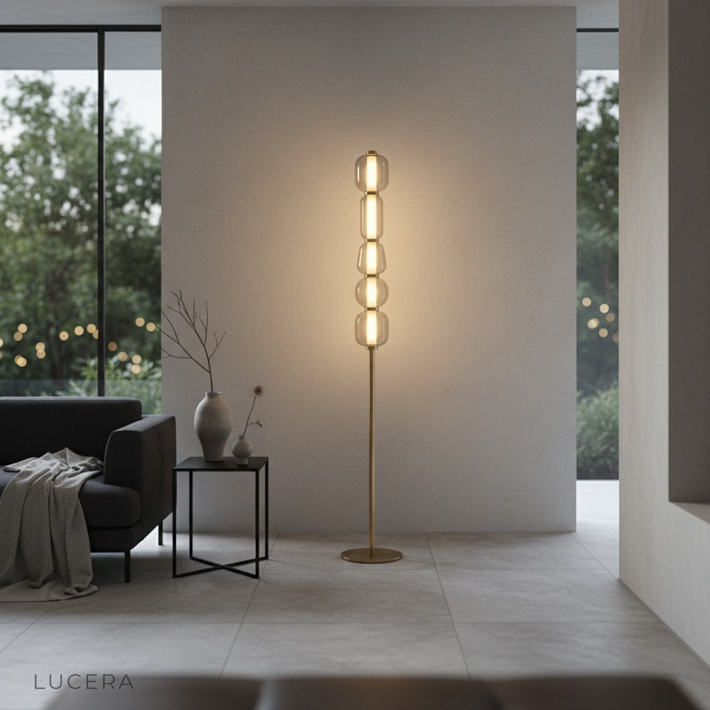 Morpheus Floor Lamp glowing warmly in evening setting with gold accents and glass spheres