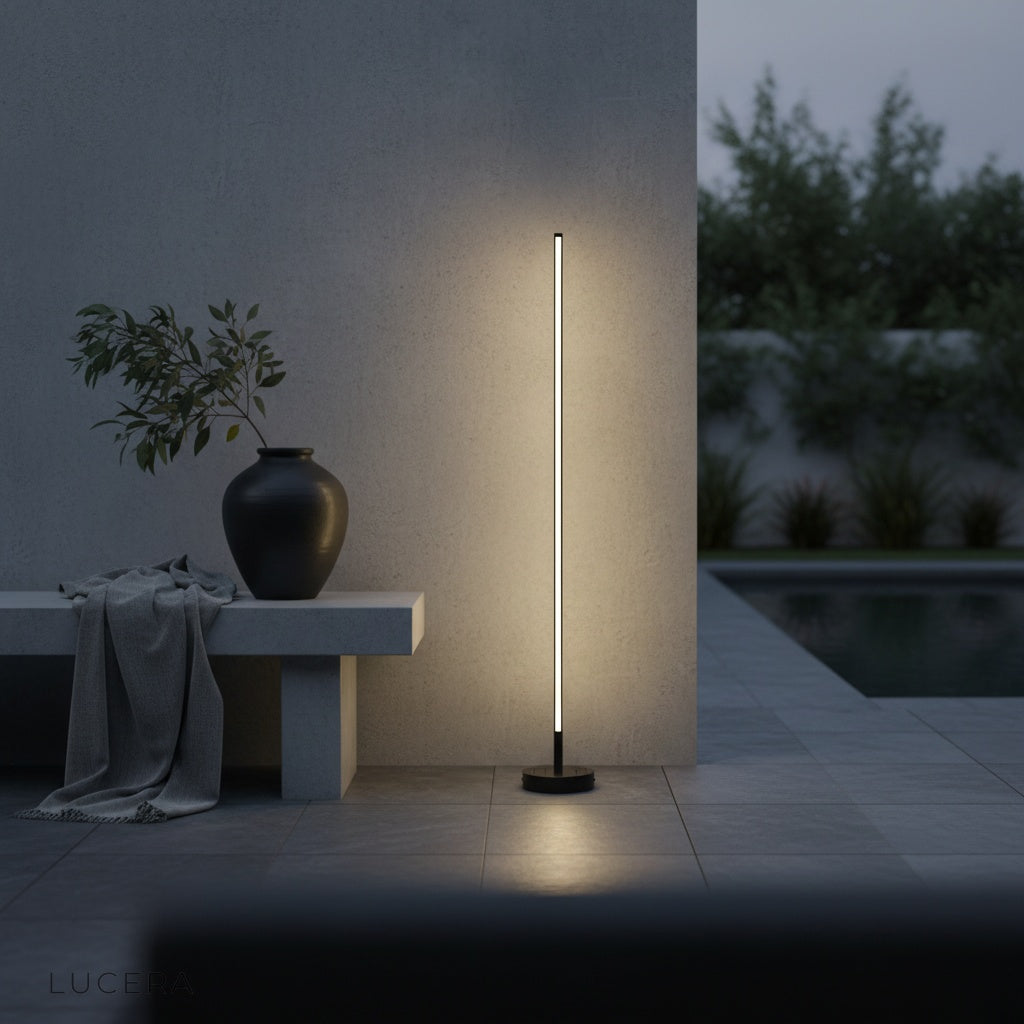 contemporary floor lamp beside a pool deck with clean architectural glow
