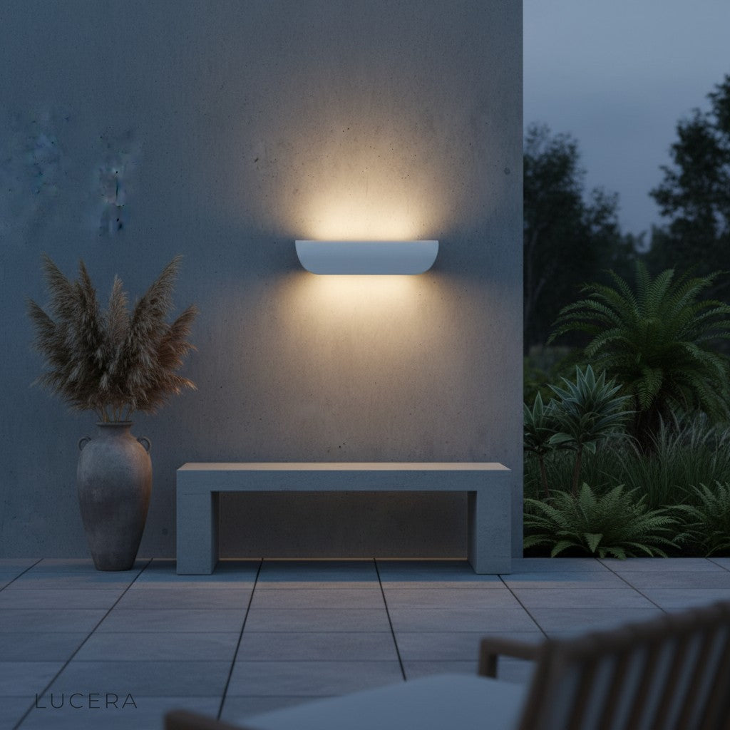 Vega sconce paired with wooden bench on a modern porch setting