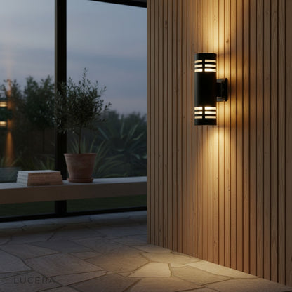 nighttime patio scene with Cleo wall light highlighting plants