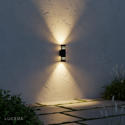 twilight garden wall with minimalist sconce lighting pathway