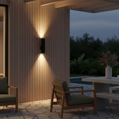 sleek outdoor sconce mounted on brick wall with dual beam illumination and minimal shadow