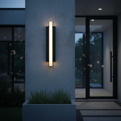 pair of Corvus LED wall lights flanking a wooden front door at dusk