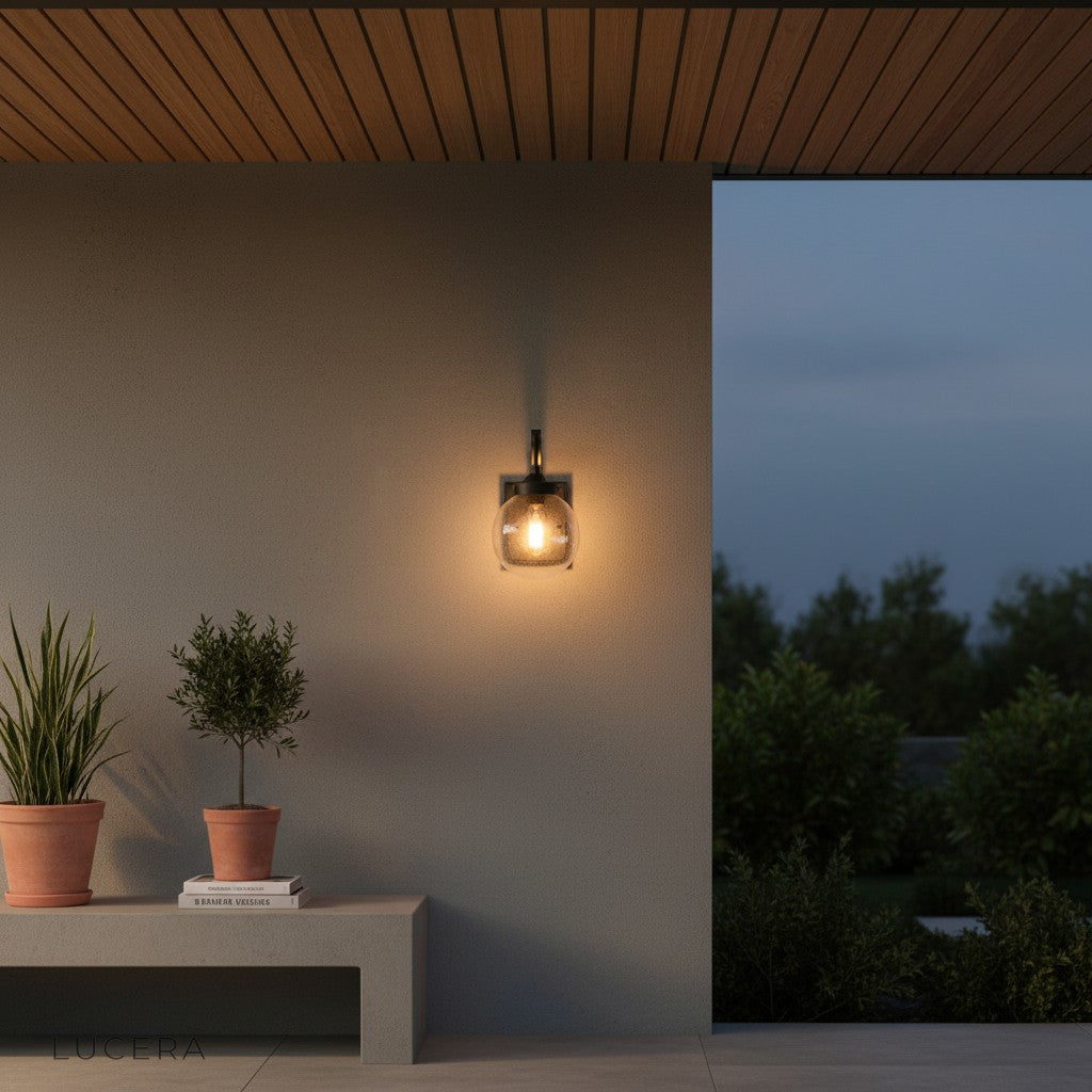 Nyx outdoor lamp illuminated at night beside a contemporary front door