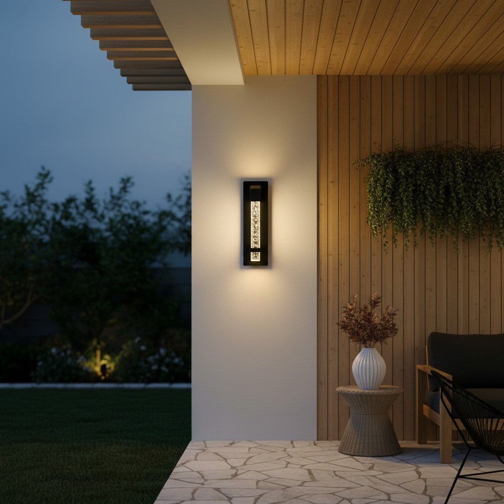 Hemera Outdoor Sconce beside a modern house number on a concrete wall