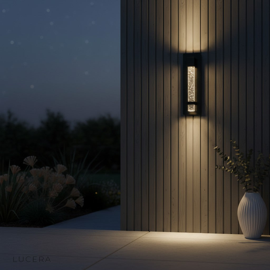 Hemera Outdoor Sconce in a covered porch setting with warm ambient light