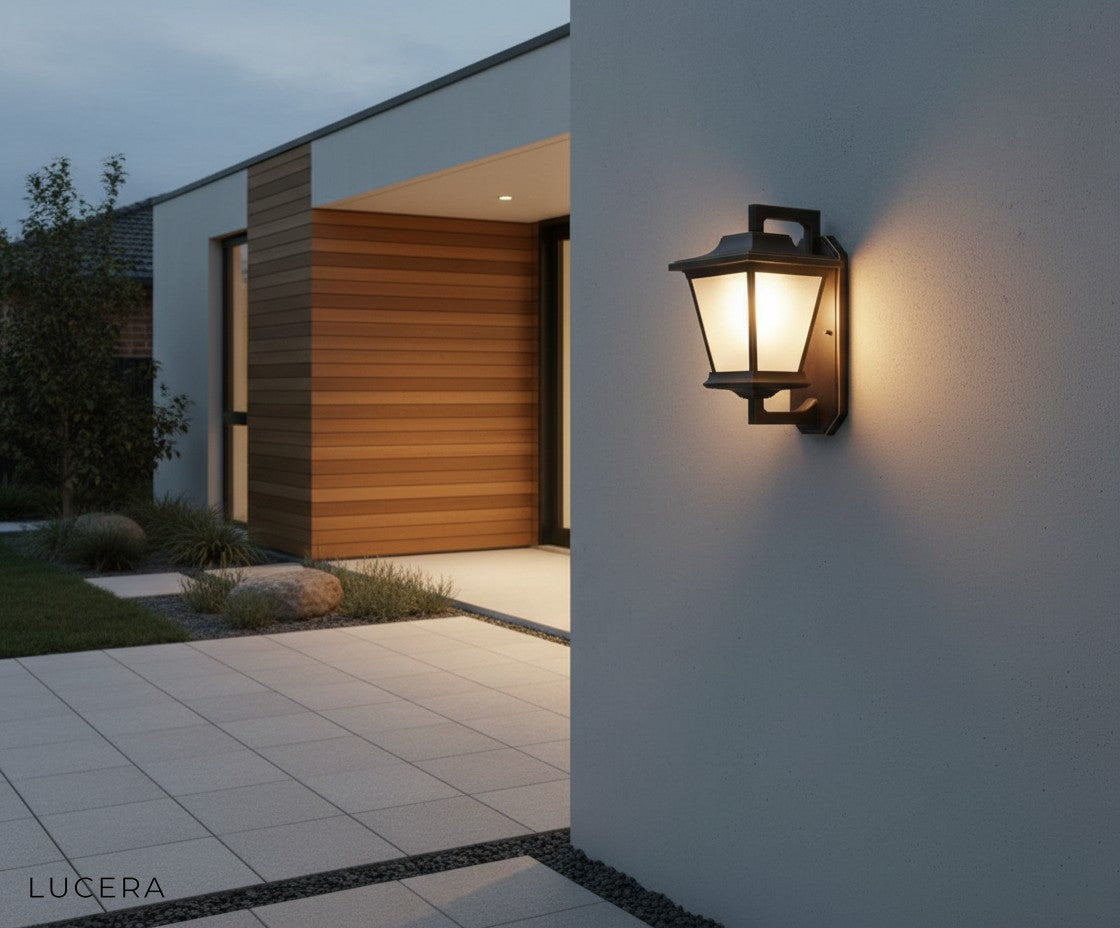Ophelia Outdoor Sconce in a minimalist courtyard, highlighting vintage industrial design