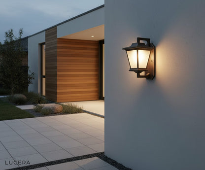 Ophelia Outdoor Sconce in a minimalist courtyard, highlighting vintage industrial design