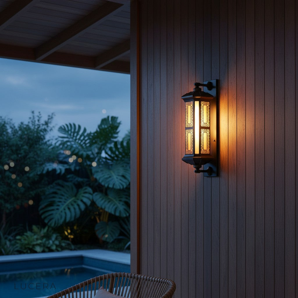 Cressida outdoor lamp mounted on brick wall near entryway with soft light