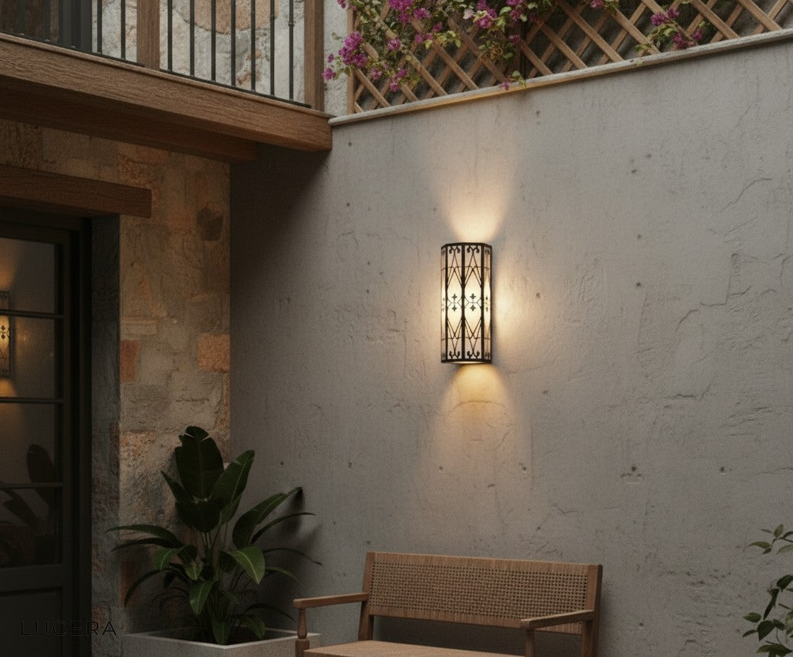Harlow Outdoor LED Lamp warm light highlighting its marble base on a modern entryway