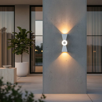 close-up detail of the Mira wall light's aluminum housing and frosted lens with warm glow