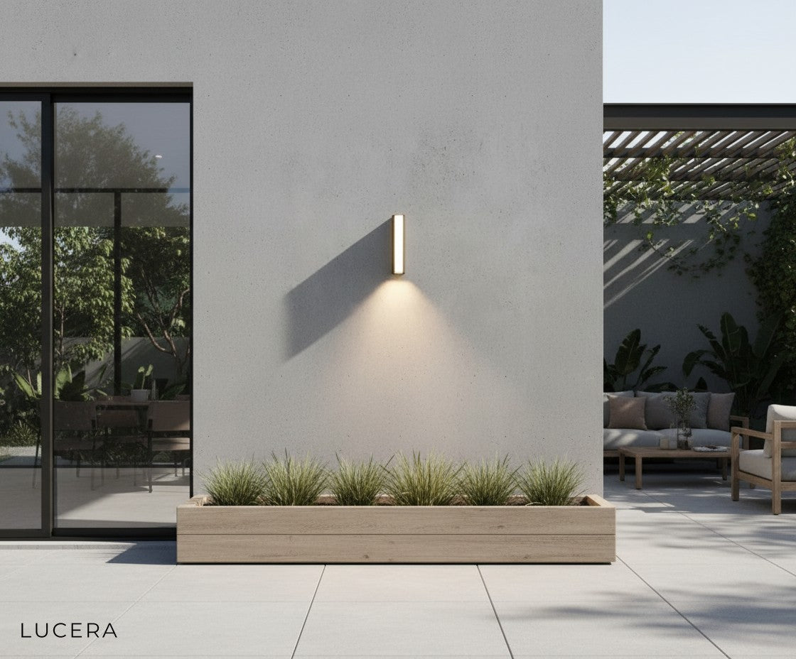 pair of black LED wall sconces flanking modern front door with warm ambiance