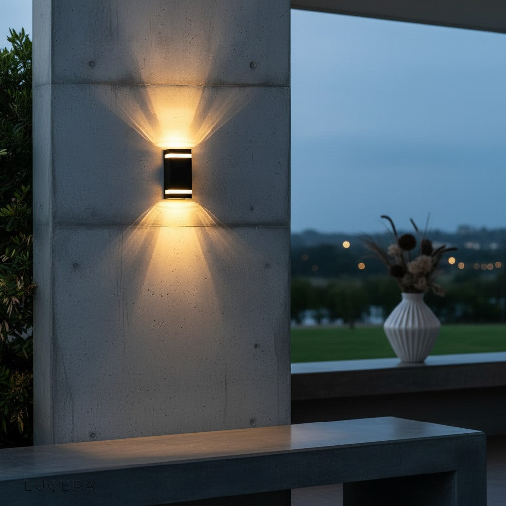 Reese lamp mounted beside a contemporary entry door with stone veneer accents