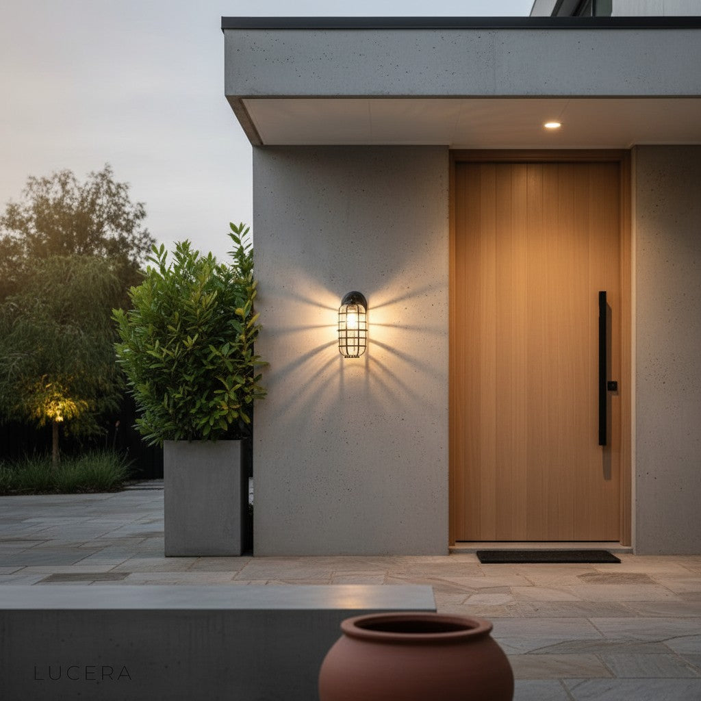 pair of Elara outdoor lights flanking a garage door in a residential setting