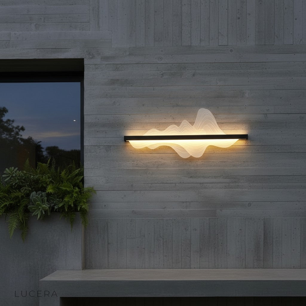 Nell LED wall lamp in a shorter length on a minimalist facade