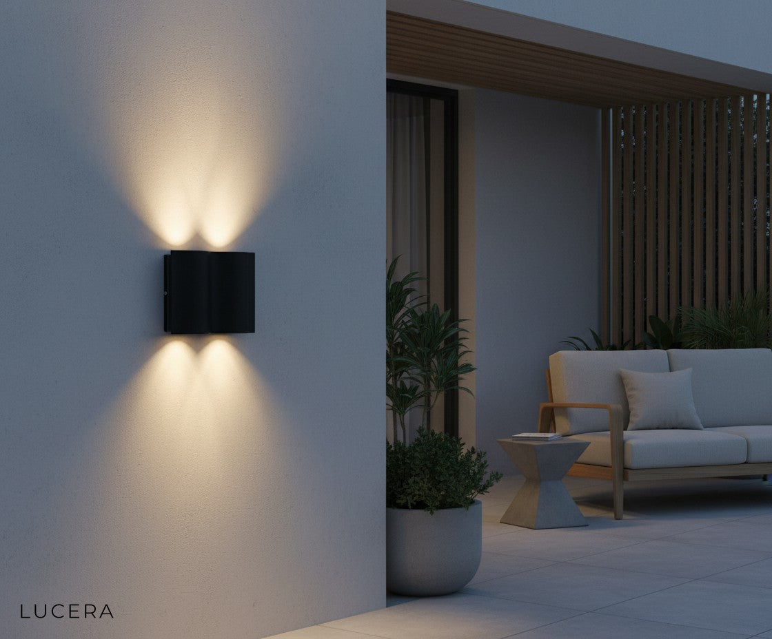 Sable Black outdoor wall lamp on a minimalist porch with ambient nighttime lighting