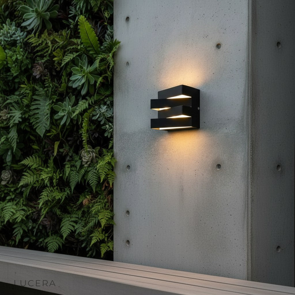 Heline wall light in cool 6000K crisp lighting on dark stucco facade