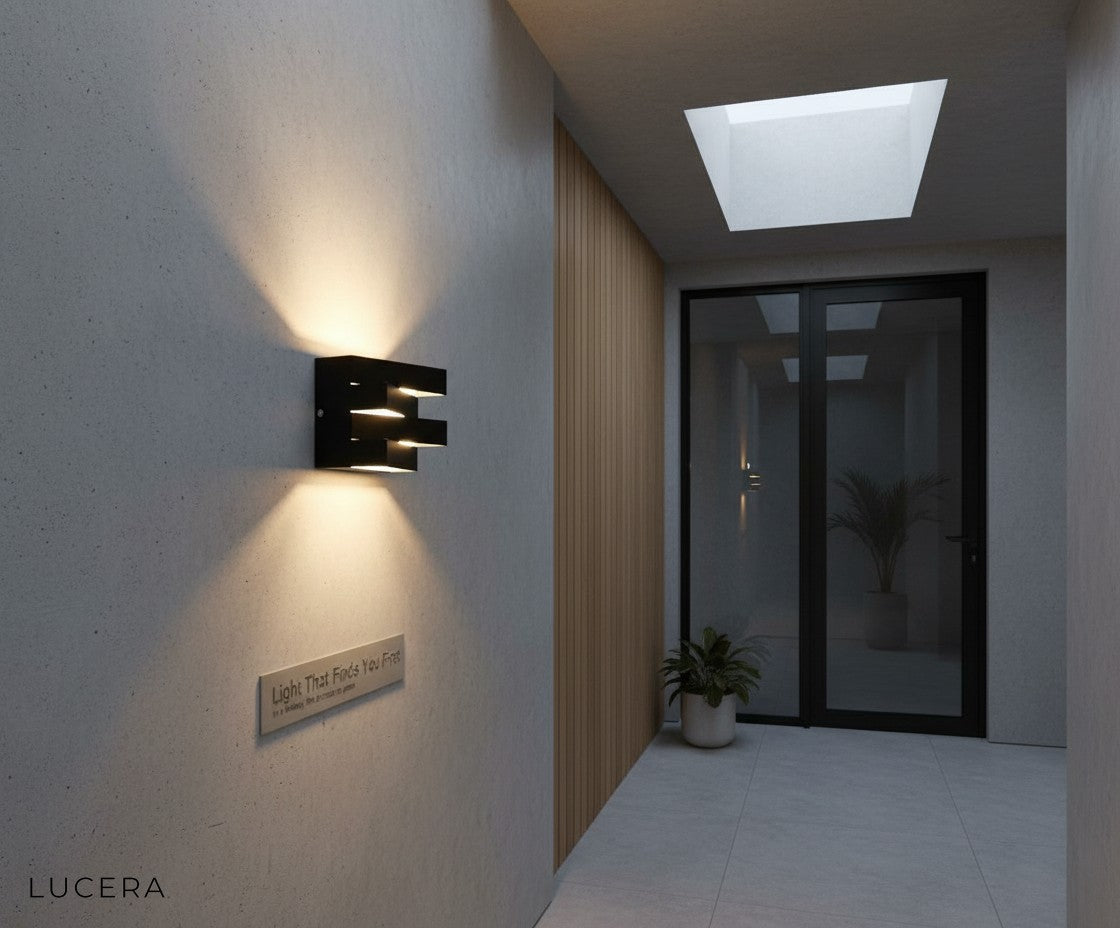matching pair of Heline outdoor lights flanking a modern entryway