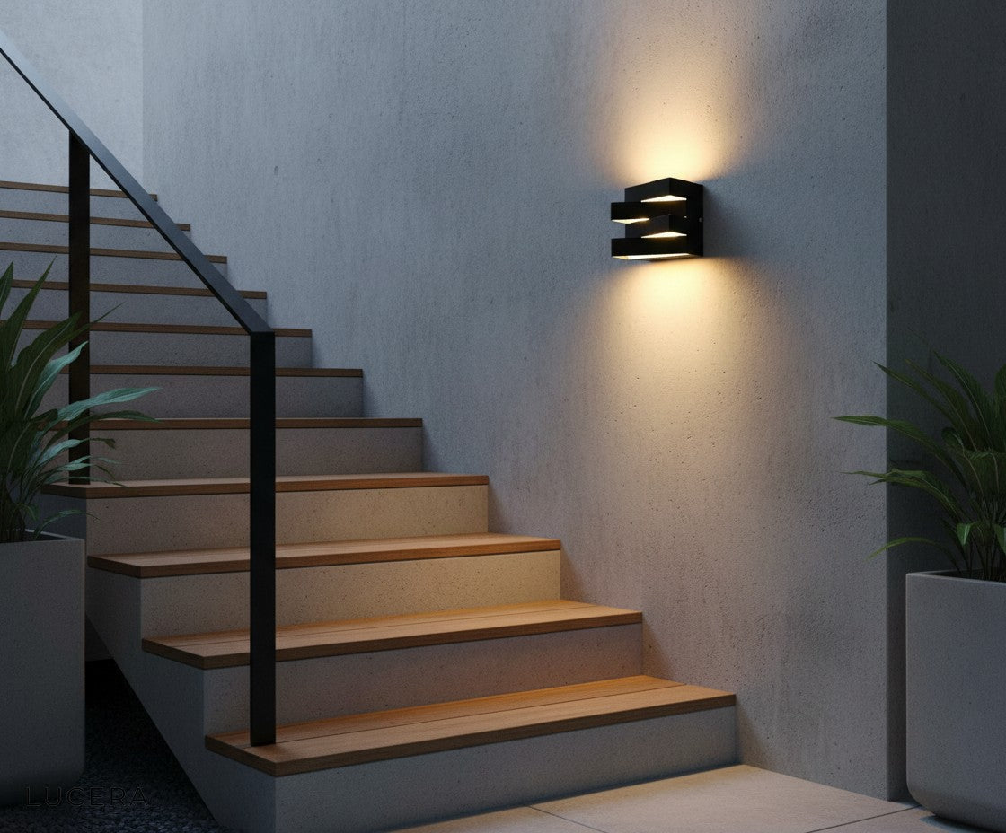 Heline LED wall light casting cozy warm light on a hallway at night