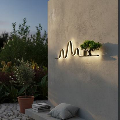 Lilou LED landscape lamp casting soft light on ivy-covered garden wall