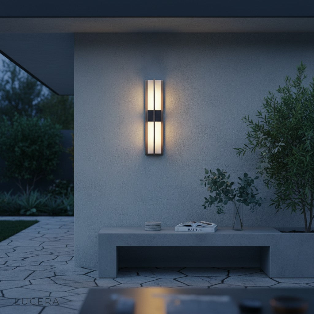 side angle of black and copper LED sconce showing slim profile and warm 3000K glow