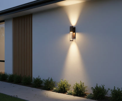 Aesthetic evening shot of the Viviane LED wall light casting inviting shadows on a textured wall