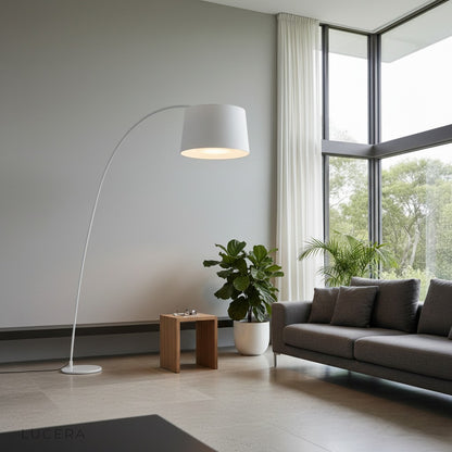 Gabbro floor lamp in a bright home office corner with white desk and plants