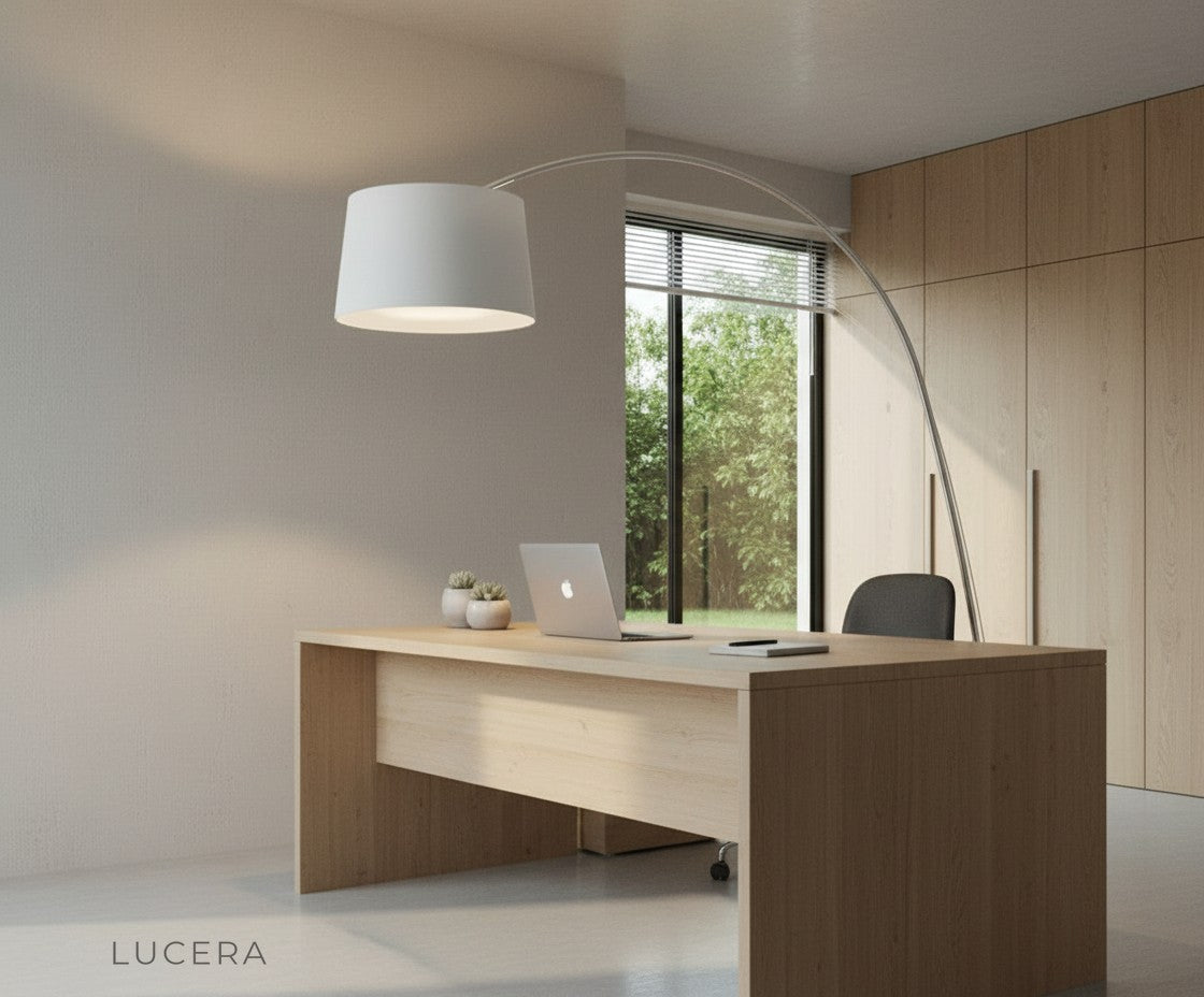 evening shot of arc lamp illuminating a dark modern dining area with wooden table