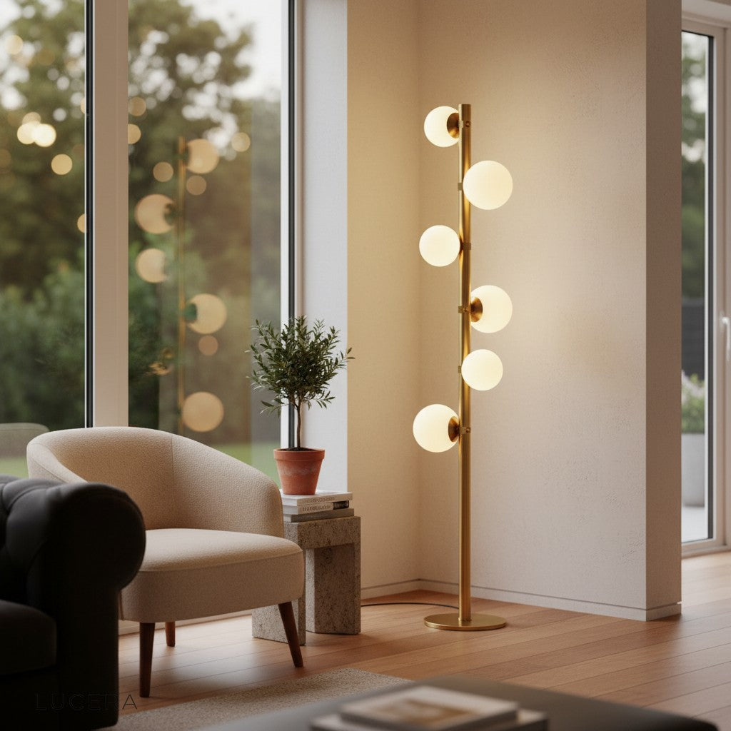 Twisted floor lamp with globe shades illuminating dark corner of stylish lounge