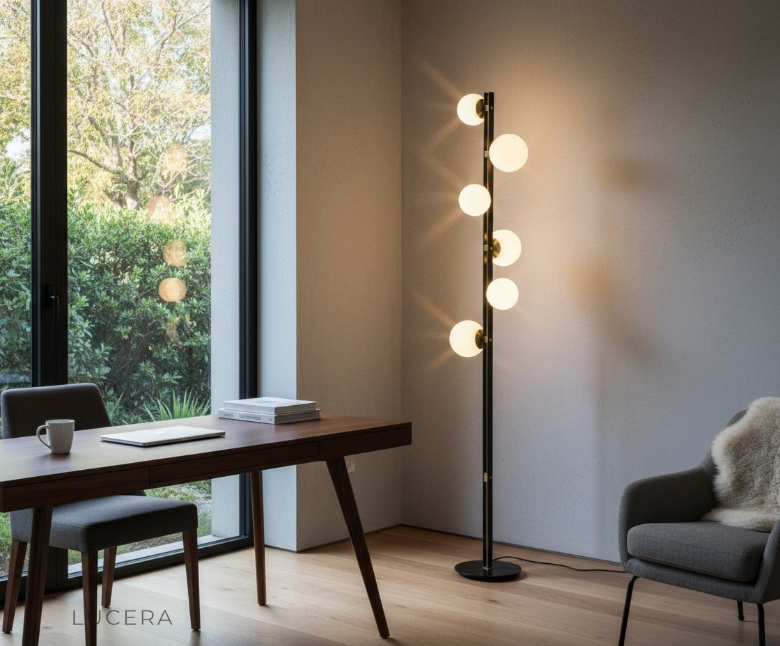 Amethyst twisted floor lamp with six lit globes in moody nighttime living room