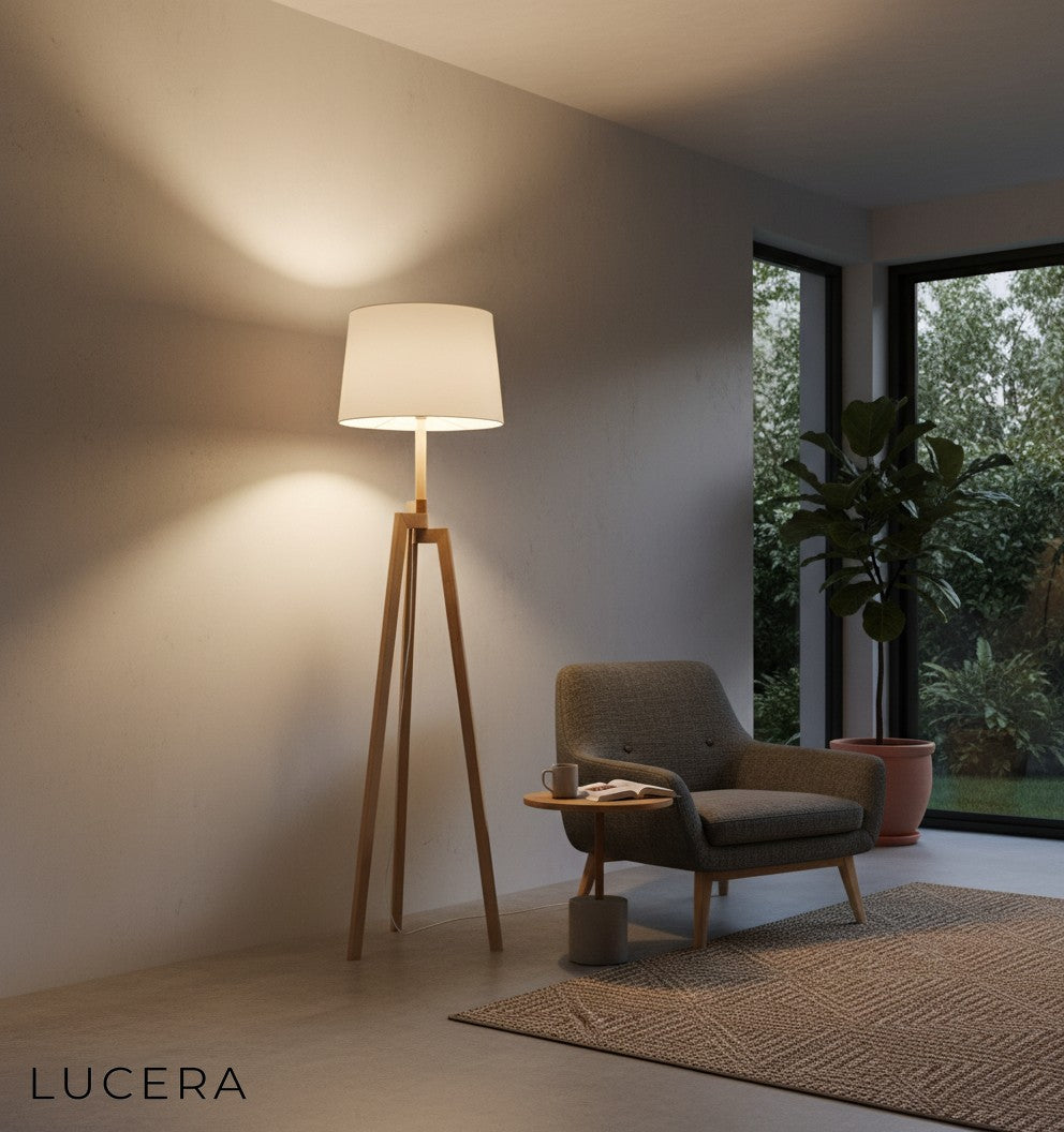 nighttime lifestyle shot of solid wood floor lamp glowing softly in dark living room