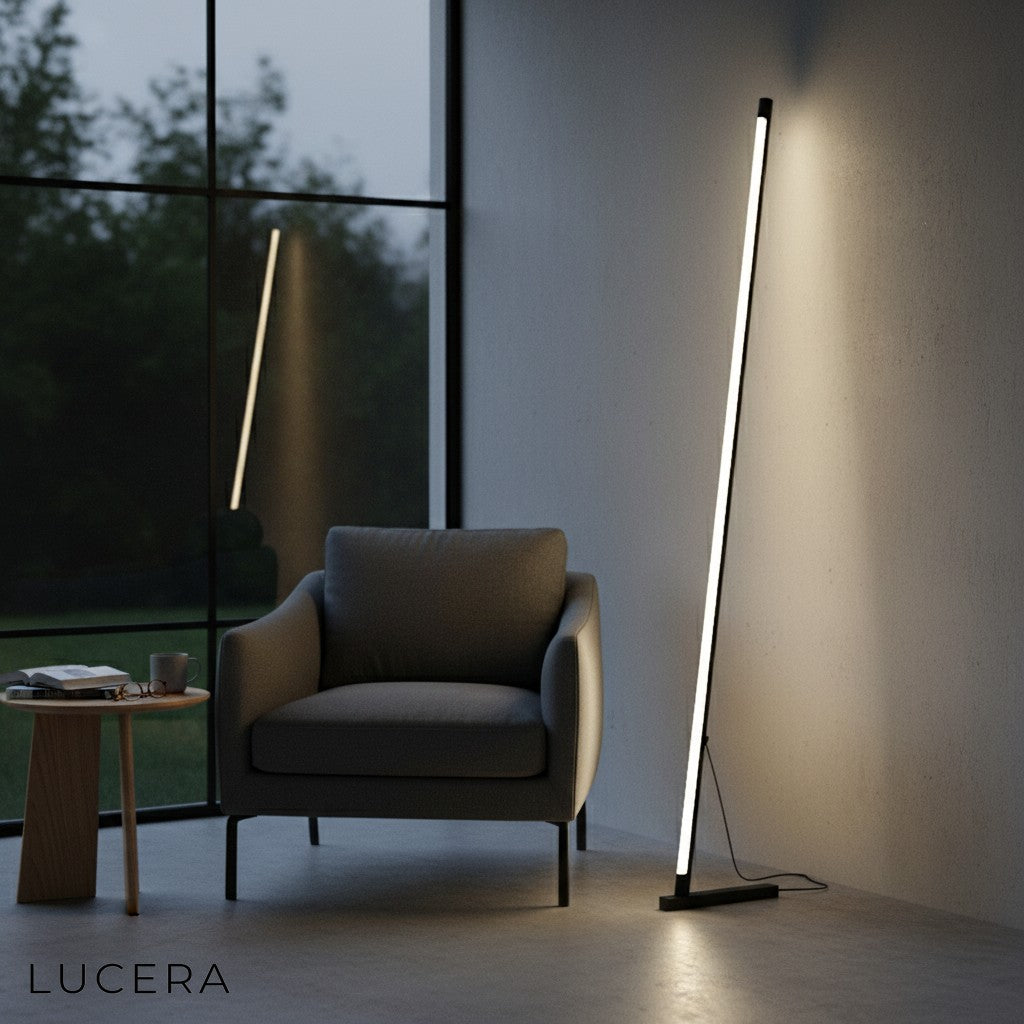 Iolite minimalistic lamp with warm light beside armchair in stylish lounge area