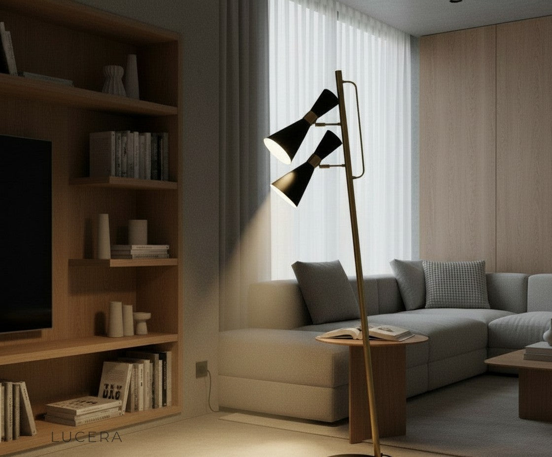 Sleek standing lamp casting soft ambient light beside a sofa in a contemporary loft space