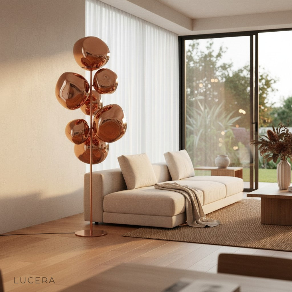 Moonstone Freiburg lamp in dark bronze finish beside cozy armchair in bedroom